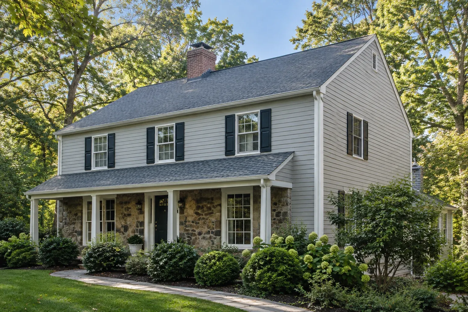 Illustrative home with an architectural-shingle roof in a leafy residential setting.